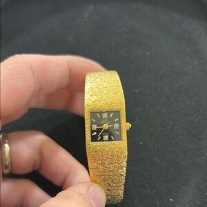Gold and Black Vintage-Style Watch with Textured Bracelet